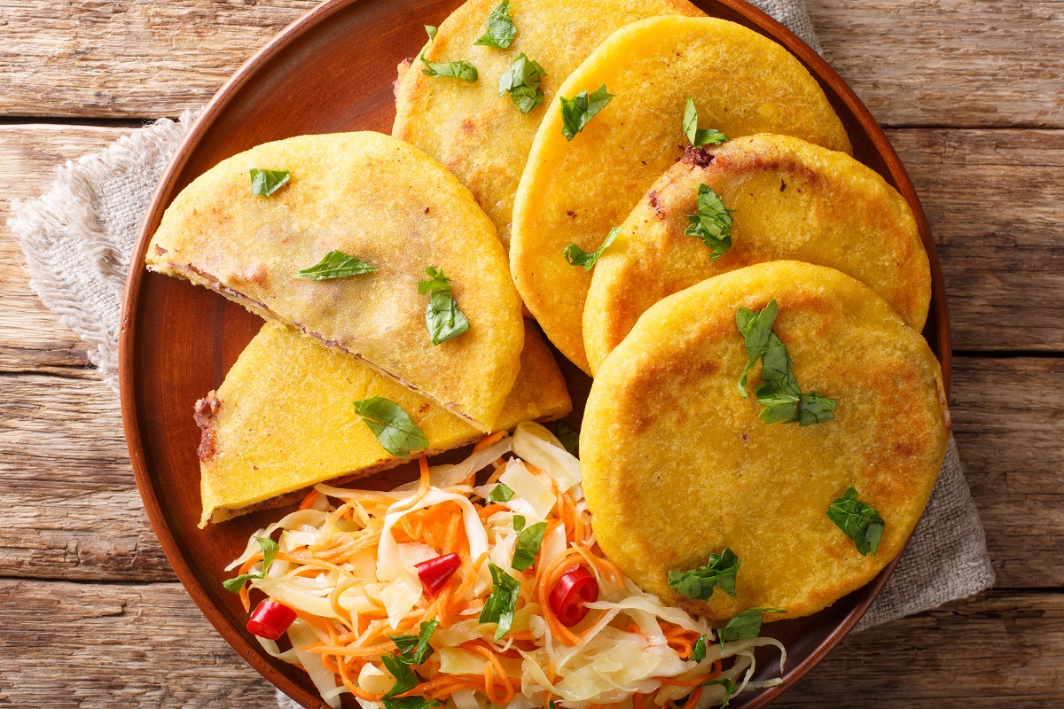 Traditional Latin American pupusas served with curtido closeup o